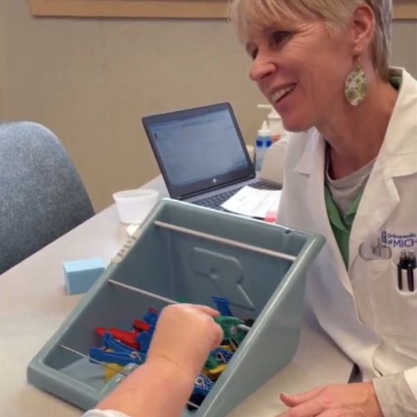 Oam Hand To Shoulder Therapy Diann Helps A Patient Strengthen Her Finger